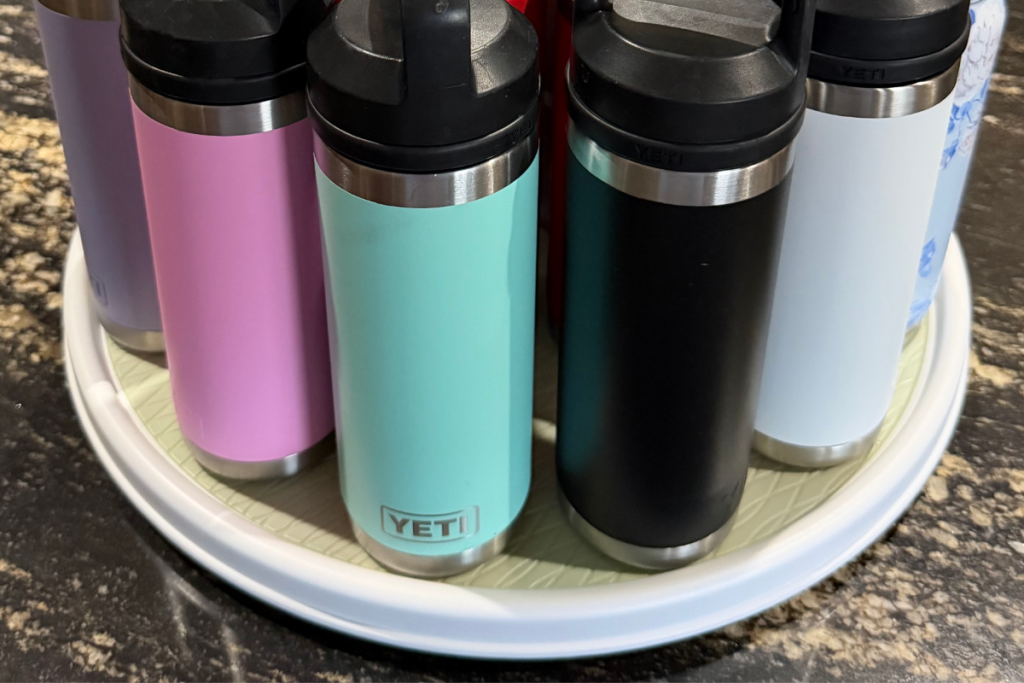 Close up of a Yeti Ramblers on a white plastic lazy susan in a clean kitchen